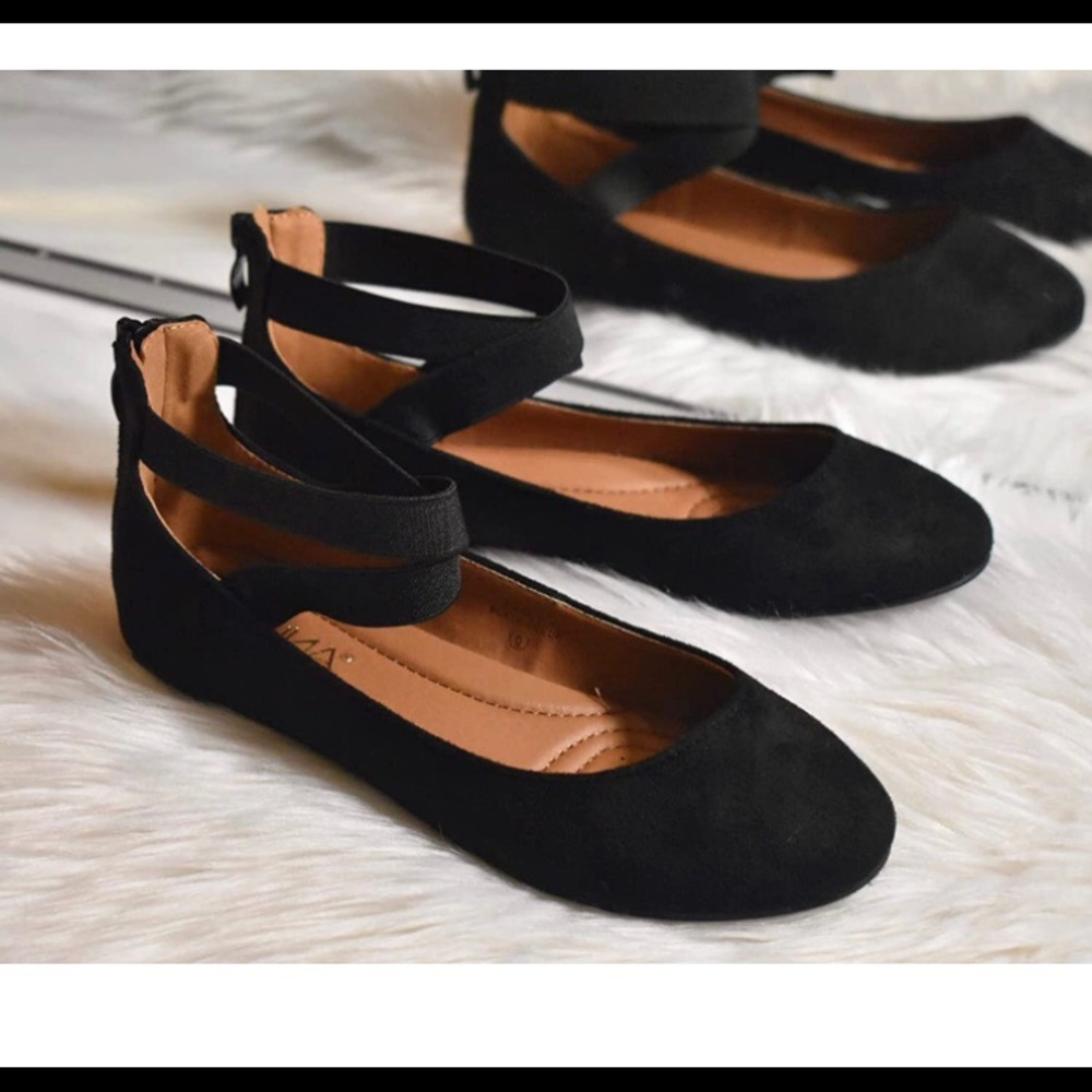 Black Bella Marie ballerina flats with ankle straps.